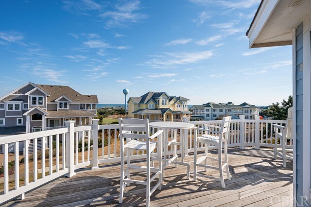 wooden deck featuring a residential view