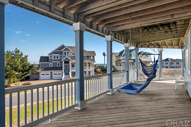 wooden terrace featuring a residential view