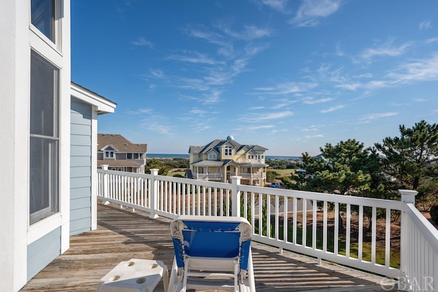 wooden terrace with a residential view