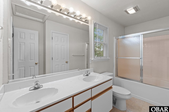 106 Mybet Ct Lot 97, Kill Devil Hills, NC 27948 - bathroom featuring double vanity, toilet, tile patterned floors, and combined bath / shower with glass door