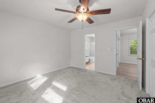 106 Mybet Ct Lot 97, Kill Devil Hills, NC 27948 - unfurnished bedroom with carpet floors, baseboards, connected bathroom, and ceiling fan
