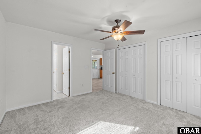106 Mybet Ct Lot 97, Kill Devil Hills, NC 27948 - unfurnished bedroom featuring carpet flooring, multiple closets, and baseboards