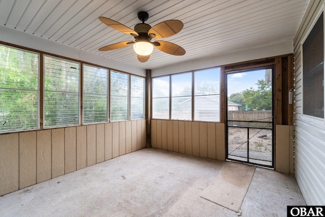 106 Mybet Ct Lot 97, Kill Devil Hills, NC 27948 - unfurnished sunroom featuring ceiling fan, wood walls, and carpet floors