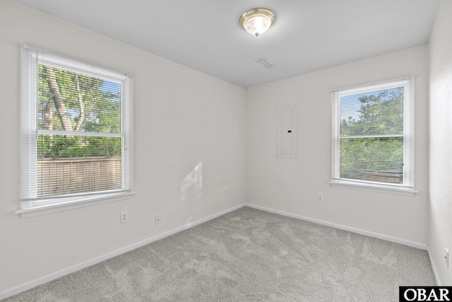 106 Mybet Ct Lot 97, Kill Devil Hills, NC 27948 - empty room with plenty of natural light, carpet, baseboards, and electric panel