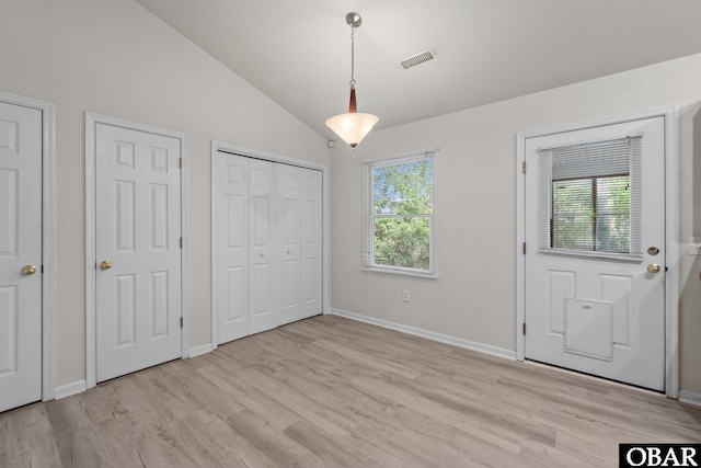 106 Mybet Ct Lot 97, Kill Devil Hills, NC 27948 - unfurnished bedroom featuring light wood-style flooring, lofted ceiling, and baseboards