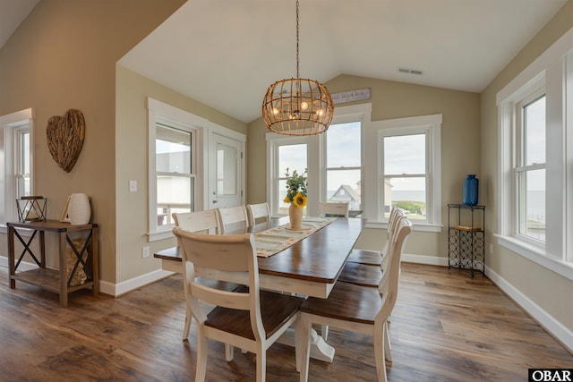 27197 Black Dog Ln Lot 9, Salvo, NC 27972 - dining area with vaulted ceiling, a chandelier, and dark wood finished floors