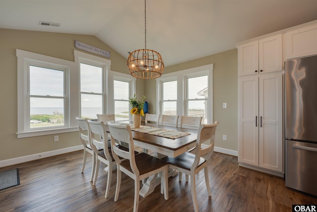 27197 Black Dog Ln Lot 9, Salvo, NC 27972 - dining area with a chandelier, dark wood-style floors, and lofted ceiling