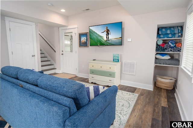 living room featuring visible vents, wood finished floors, recessed lighting, baseboards, and stairs