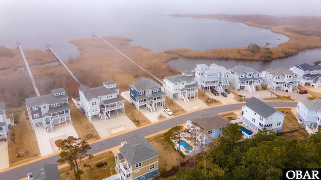 bird's eye view featuring a residential view and a water view