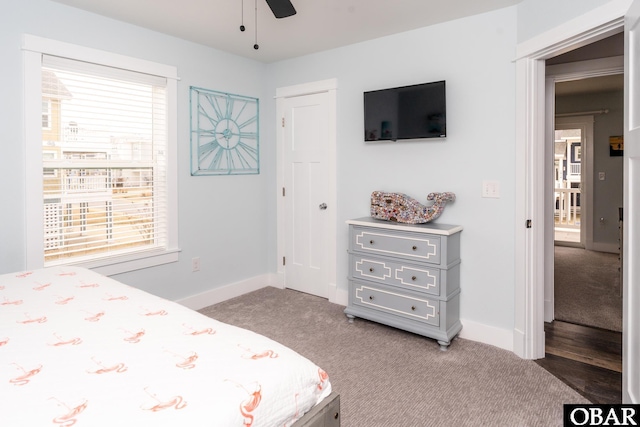 bedroom featuring baseboards and light carpet