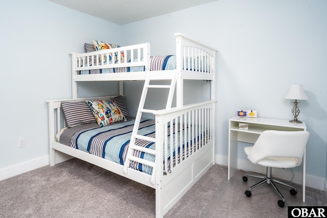 carpeted bedroom with baseboards