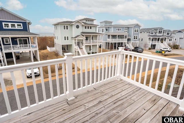 wooden deck with a residential view