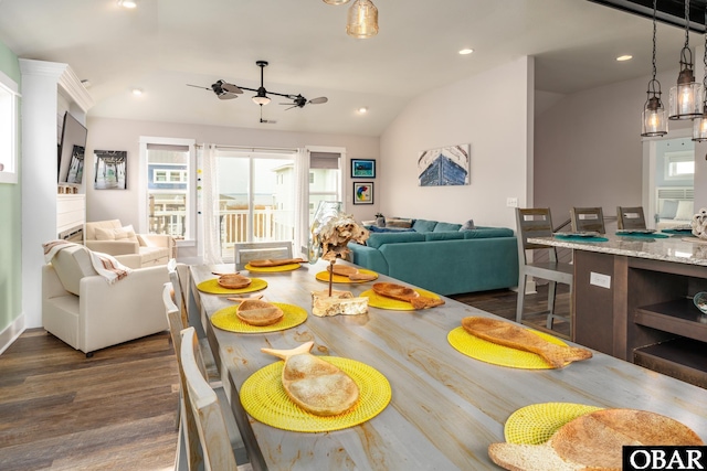 dining space with recessed lighting, lofted ceiling, dark wood-type flooring, and a ceiling fan