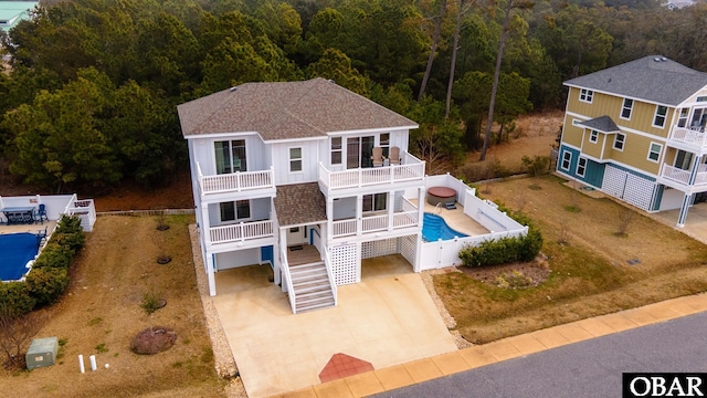 aerial view featuring a wooded view