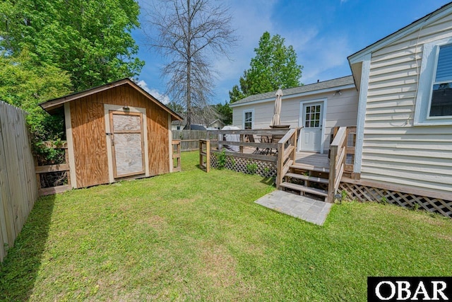 807 S St Lot 11, Manteo, NC 27954 - view of yard with a fenced backyard, a storage unit, a wooden deck, and an outdoor structure