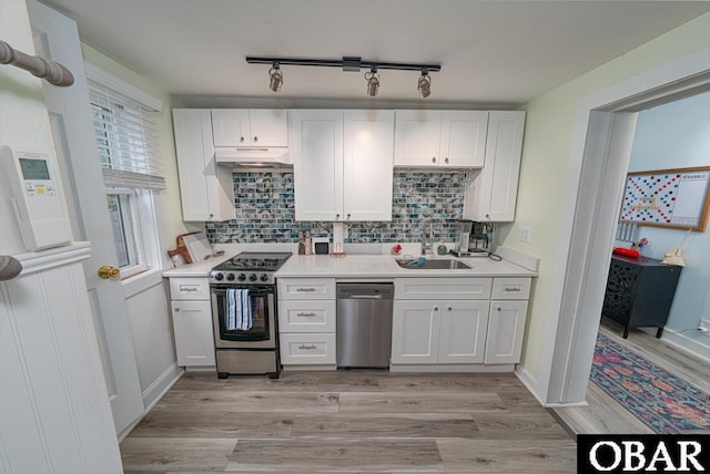 807 S St Lot 11, Manteo, NC 27954 - kitchen with a sink, appliances with stainless steel finishes, under cabinet range hood, and white cabinets
