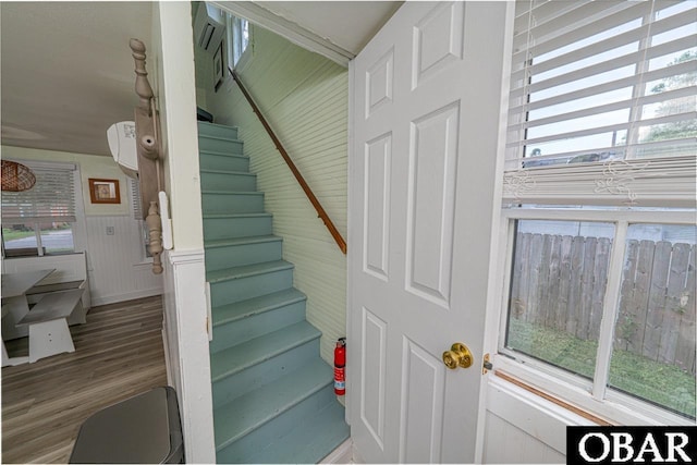 807 S St Lot 11, Manteo, NC 27954 - stairs featuring wainscoting, a healthy amount of sunlight, and wood finished floors