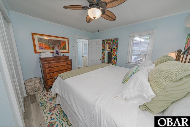 807 S St Lot 11, Manteo, NC 27954 - bedroom featuring ornamental molding, a ceiling fan, and wood finished floors