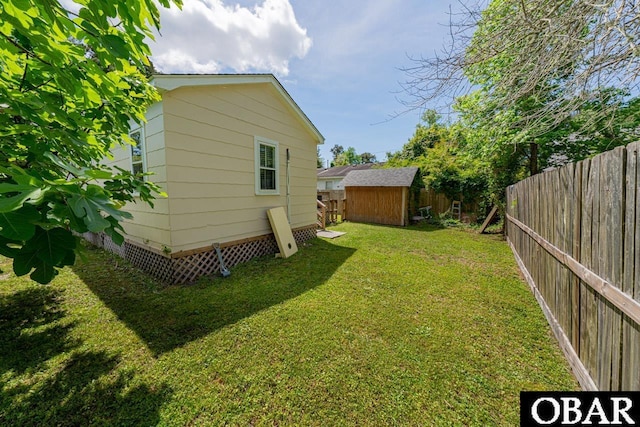 807 S St Lot 11, Manteo, NC 27954 - exterior space featuring a storage shed, an outdoor structure, and a fenced backyard