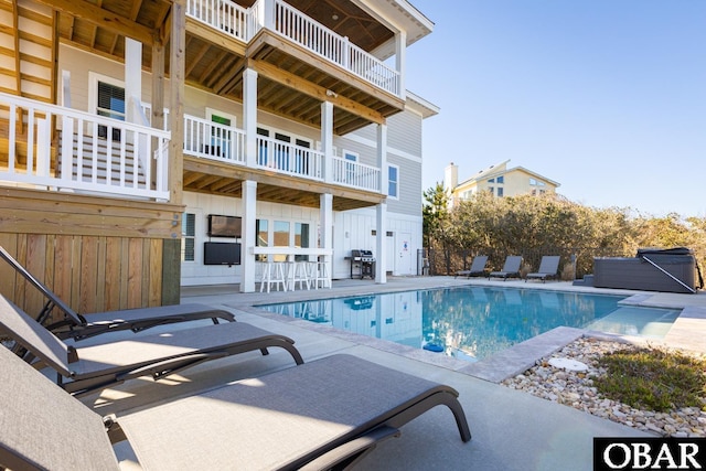 view of pool featuring a fenced in pool, a patio, and grilling area