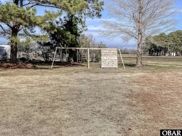 view of property's community featuring a playground