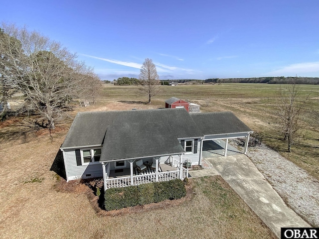 view of front of house with a porch, crawl space, a rural view, and driveway