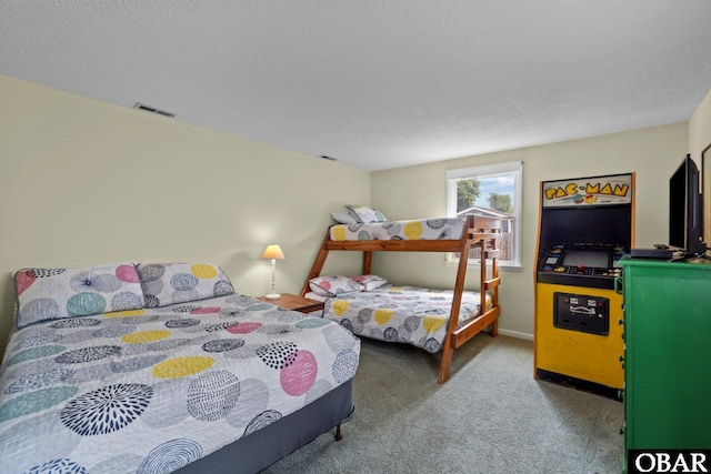carpeted bedroom with a textured ceiling and visible vents