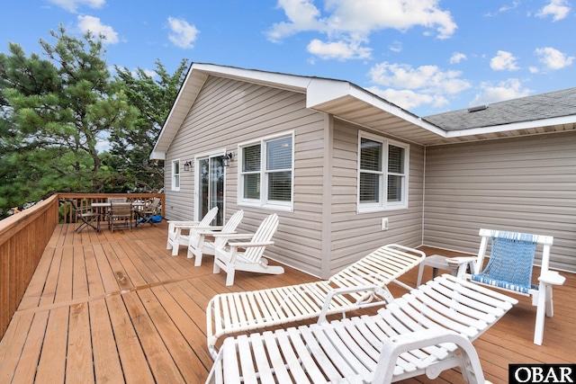 wooden deck featuring outdoor dining space