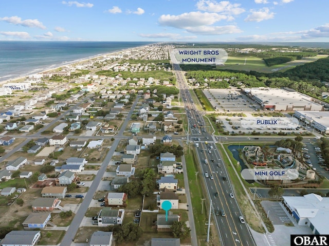 aerial view with a water view and a view of the beach