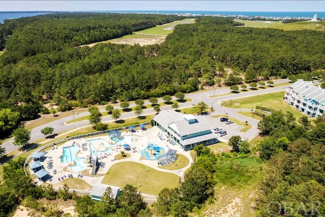 aerial view featuring a wooded view