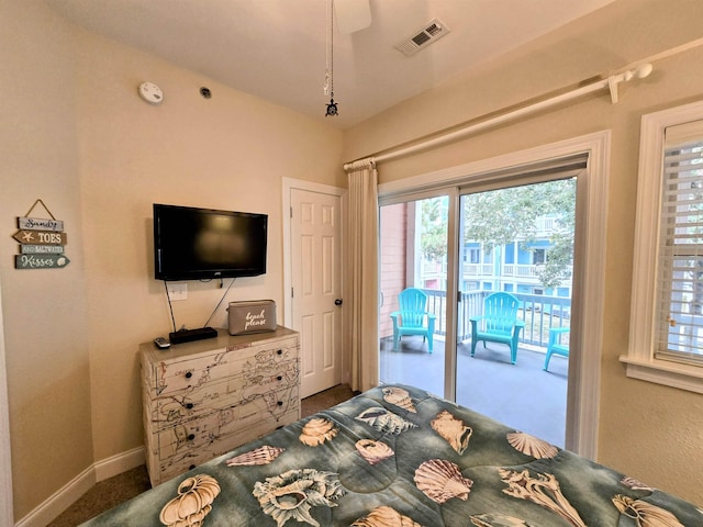 1111 Cambridge Rd Unit 308B, Kill Devil Hills, NC 27948 - bedroom featuring access to exterior, multiple windows, and baseboards