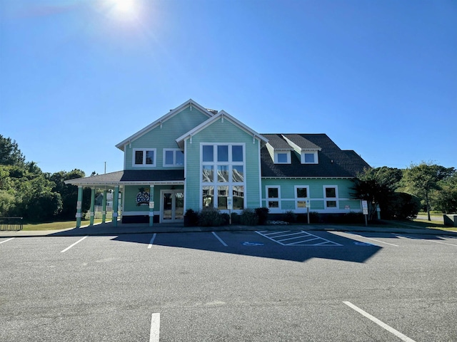 1111 Cambridge Rd Unit 308B, Kill Devil Hills, NC 27948 - view of building exterior featuring uncovered parking