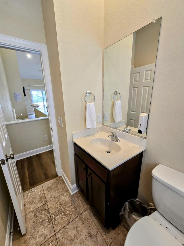 1111 Cambridge Rd Unit 308B, Kill Devil Hills, NC 27948 - half bathroom with vanity, toilet, and tile patterned flooring