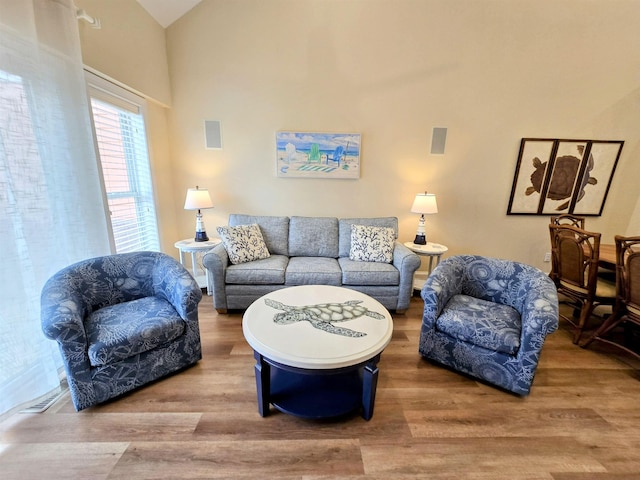 1111 Cambridge Rd Unit 308B, Kill Devil Hills, NC 27948 - living room with wood finished floors and high vaulted ceiling