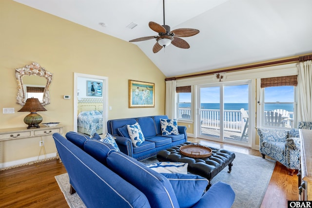 living room featuring a water view, baseboards, vaulted ceiling, and dark wood-type flooring