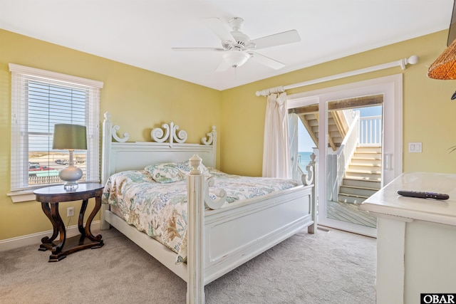 bedroom with light carpet, baseboards, a ceiling fan, and access to exterior