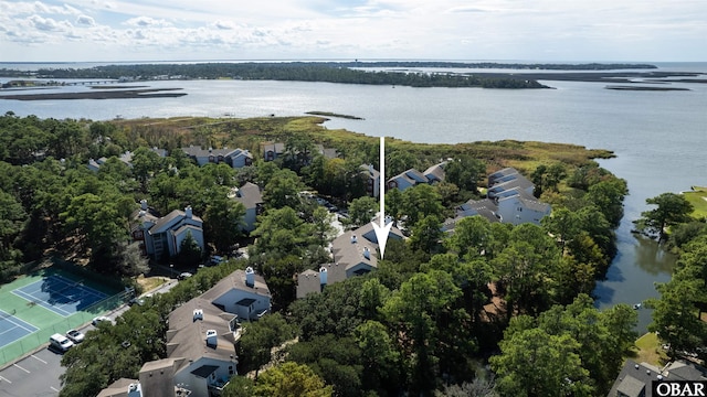 drone / aerial view with a water view and a residential view