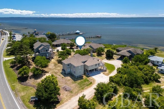 birds eye view of property featuring a residential view and a water view