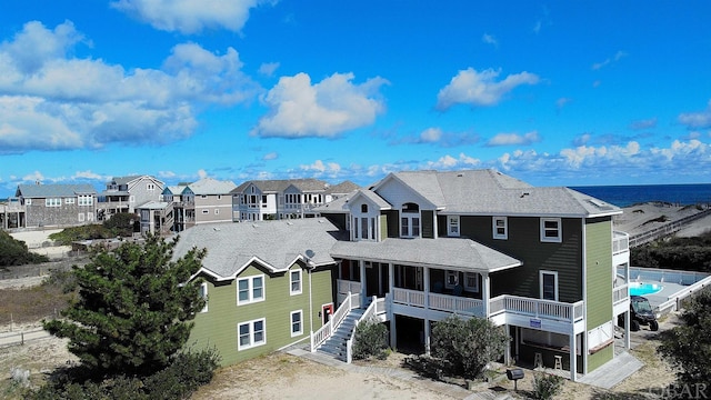 exterior space with a water view and a residential view