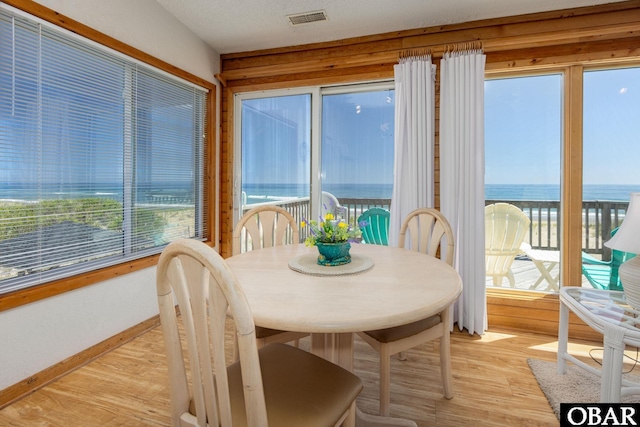 8415 S Old Oregon Inlet Rd Lot, Lot, Nags Head, NC 27959 - sunroom featuring wood finished floors, a water view, and baseboards