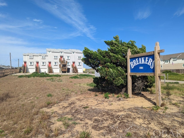 view of property's community with fence