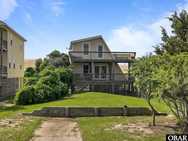 118 W Soundside Rd Lot Pt7, Nags Head, NC 27959 - rear view of house with a yard, a deck, and a balcony