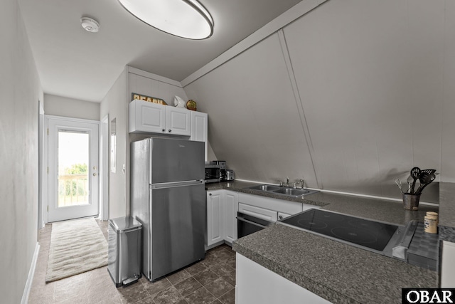 118 W Soundside Rd Lot Pt7, Nags Head, NC 27959 - kitchen featuring stainless steel appliances, a sink, dark countertops, and white cabinets