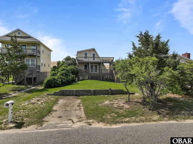 118 W Soundside Rd Lot Pt7, Nags Head, NC 27959 - view of front of house with a front lawn, stairway, and a balcony