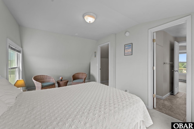 118 W Soundside Rd Lot Pt7, Nags Head, NC 27959 - bedroom with a baseboard radiator, vaulted ceiling, and baseboards
