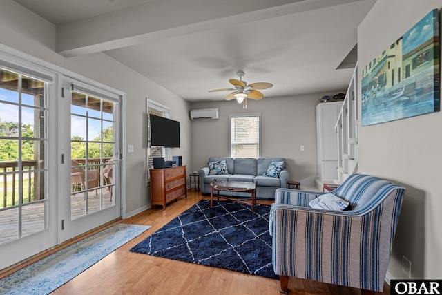 118 W Soundside Rd Lot Pt7, Nags Head, NC 27959 - living room with a wall mounted AC, ceiling fan, wood finished floors, and baseboards