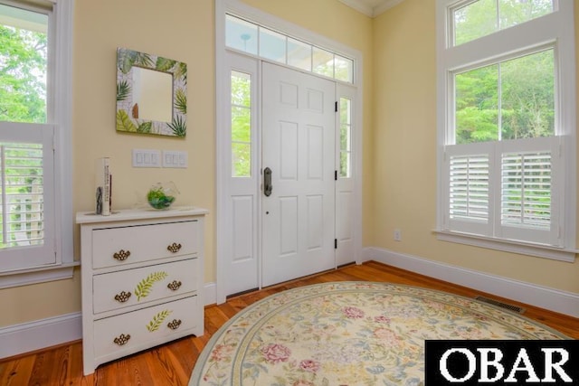 102 William And Mary Way Lot 13, Manteo, NC 27954 - foyer featuring light wood-type flooring, baseboards, and ornamental molding