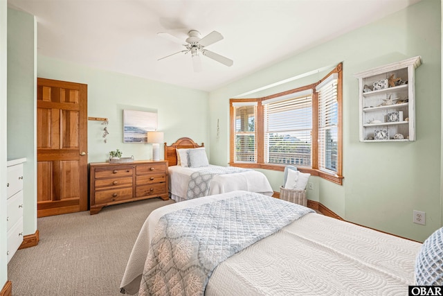 carpeted bedroom with a ceiling fan