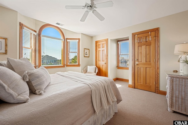 bedroom featuring carpet, lofted ceiling, visible vents, ceiling fan, and baseboards