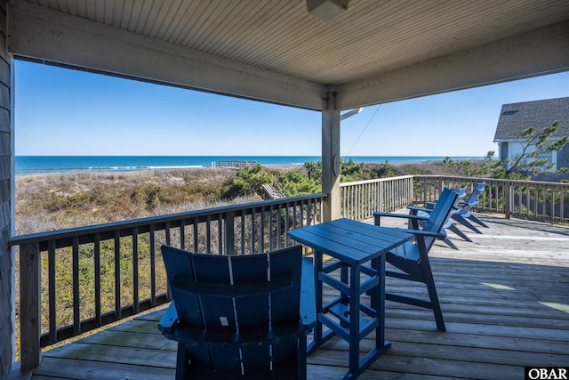 wooden deck with a water view